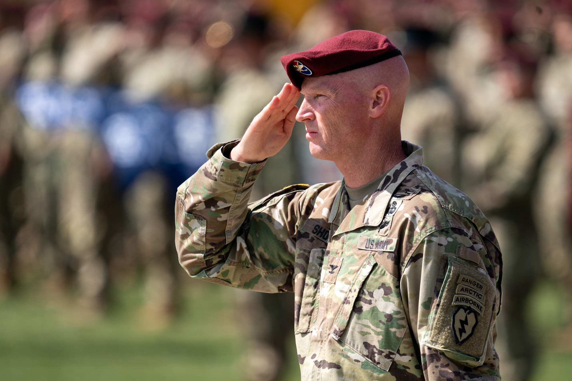 Photo of Col Michael Shouse saluting