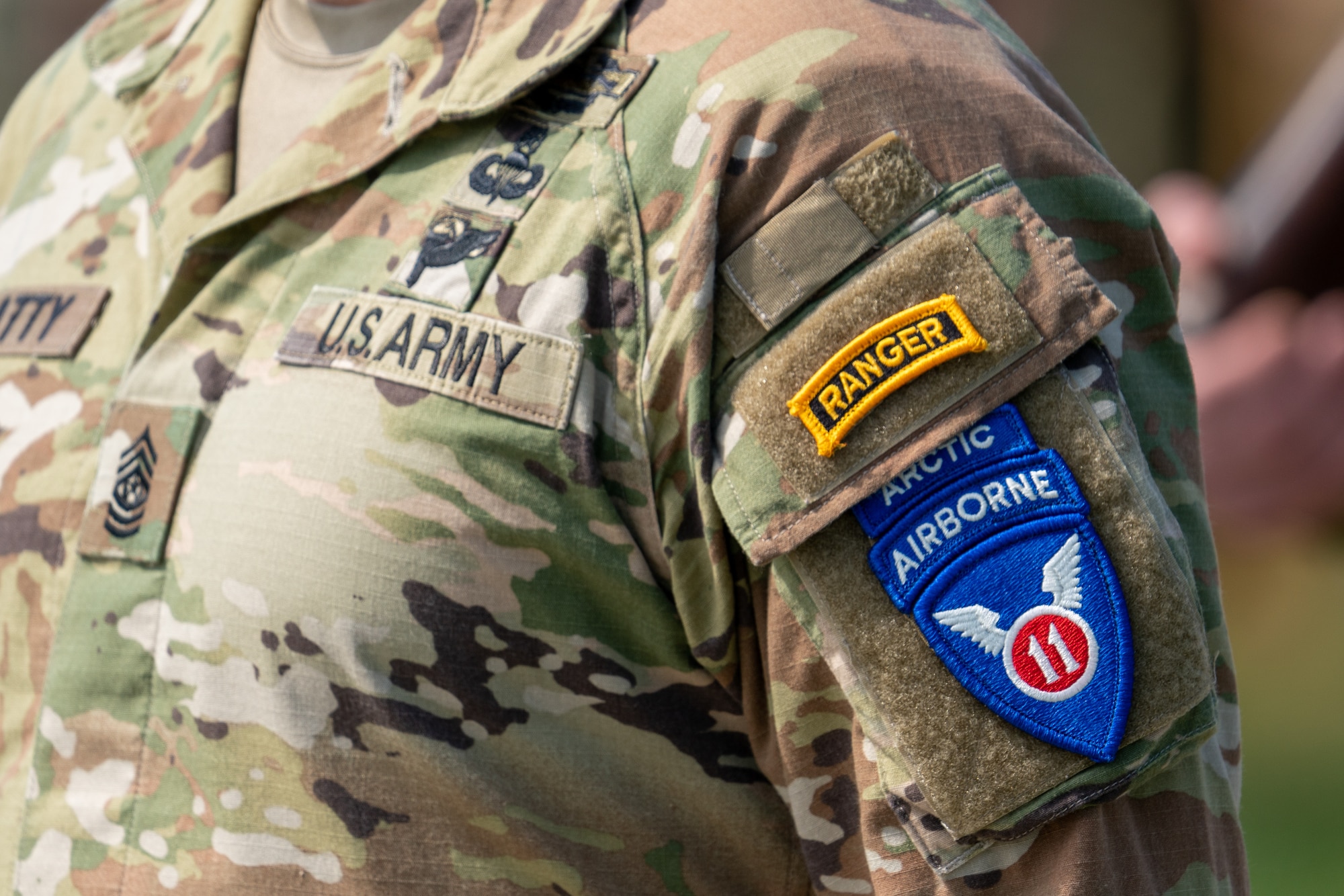 A Soldier stands in formation during a ceremony bearing the new 11th Airborne patch