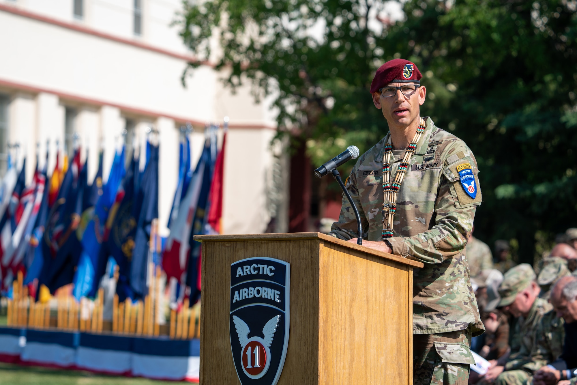 U.S. Army Major General Brian Eifler speaks at a podium during a ceremony