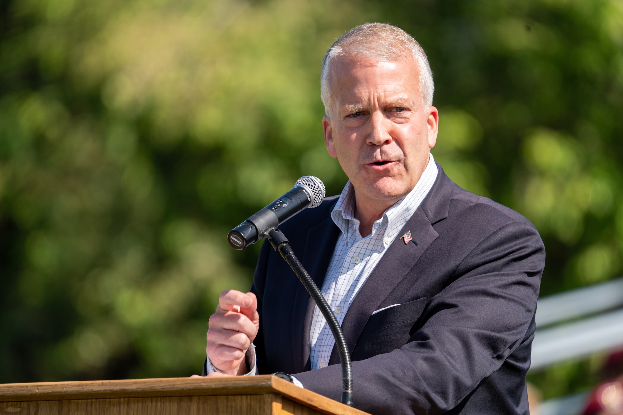 Alaska Senator Dan Sullivan speaks at a podium