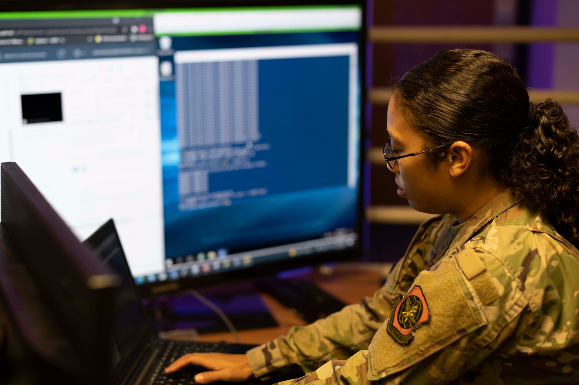 U.S. Air Force Staff Sgt. Pericia Barrow, 60th Communications Squadron cyber systems operator, works on a computer Sept. 23, 2021, at Travis Air Force Base, California. The 60th Communications Squadron maintains and troubleshoots Air Mobility Command’s second largest network, providing secure and non-secure connectivity for Travis AFB’s three wings and 55 partner units. (U.S. Air Force photo by Airman 1st Class Alexander Merchak)