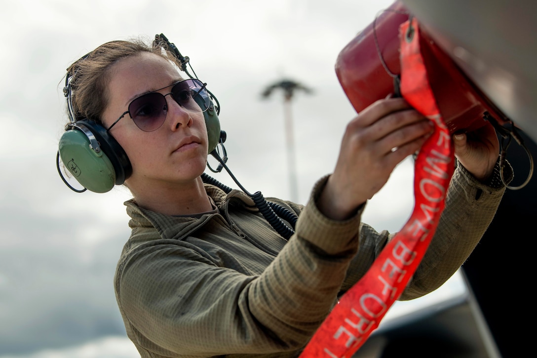 An airman works on an aircraft.