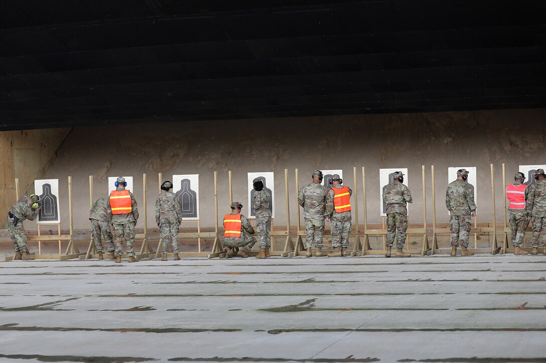 U.S. Army Reserve Soldiers, assigned to the Headquarters and Headquarters Company, 85th U.S. Army Reserve Support Command, mark their silhouettes during individual weapons qualification at the Joliet Training Area, June 8, 2022.