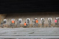 U.S. Army Reserve Soldiers, assigned to the Headquarters and Headquarters Company, 85th U.S. Army Reserve Support Command, mark their silhouettes during individual weapons qualification at the Joliet Training Area, June 8, 2022.