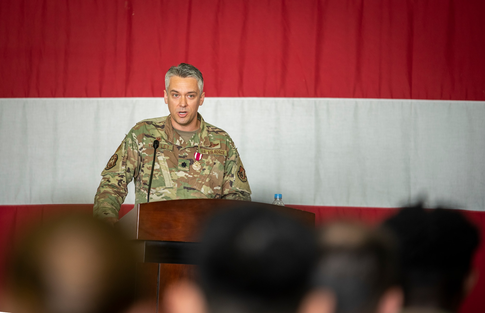 Lt. Col. William Yoakley, 51st Operations Support Squadron outgoing commander, delivers a farewell speech during the OSS Change of Command at Osan Air Base, Republic of Korea, June 7, 2022.