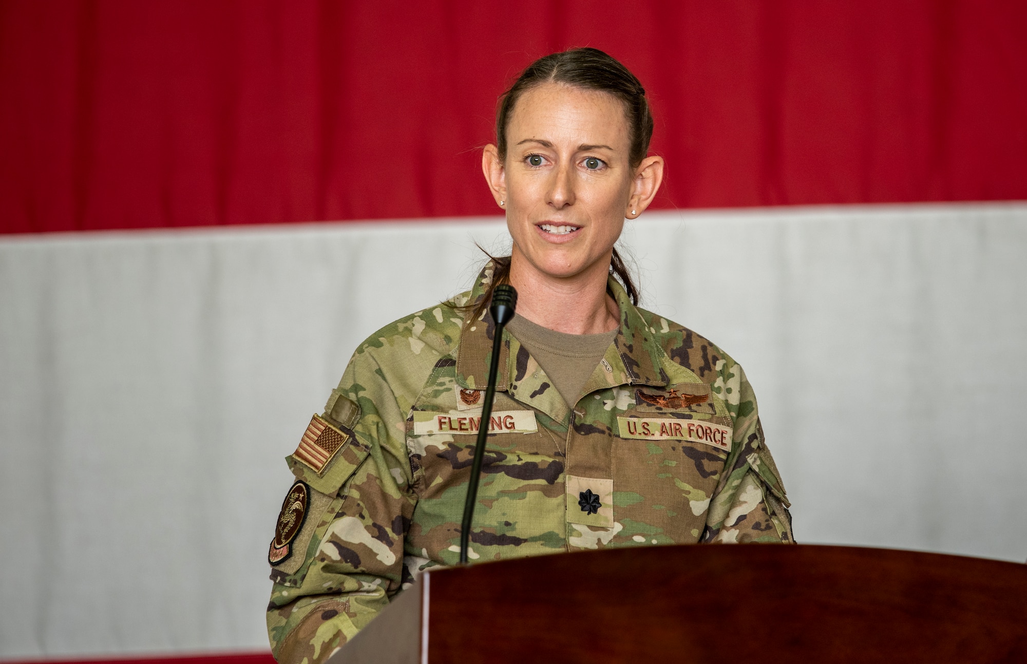 Lt. Col. Chandra Fleming, 51st Operations Support Squadron newly-appointed commander, addresses the audience after taking command of the OSS at Osan Air Base, Republic of Korea, June 7, 2022.