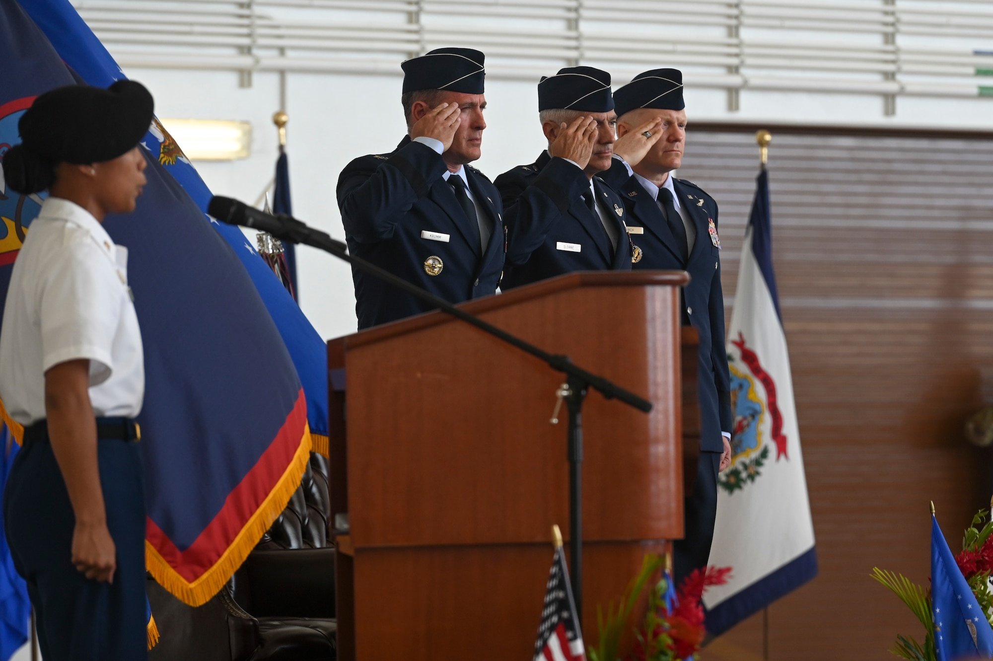 U.S. Air Force Lt. Gen. David A. Krumm, Brig. Gen. Jeremy T. Sloane, and Brig. Gen. Paul R. Birch, salute as the National Anthem is sung at a change of command ceremony June 10, 2022, at Andersen Air Force Base, Guam.