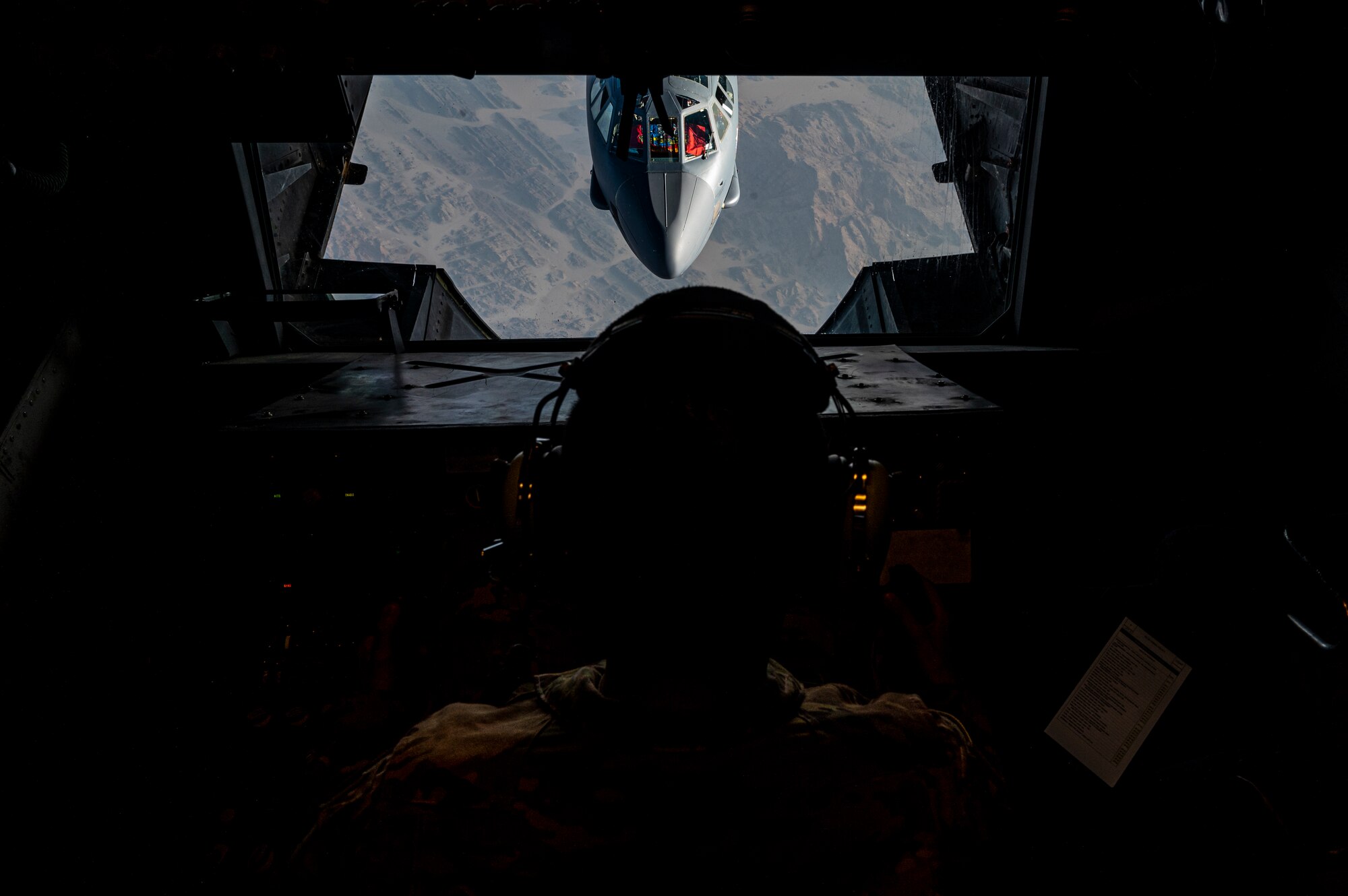 Staff Sgt. Edwin Gomez Rivera, a boom operator assigned to the 908th Expeditionary Air Refuel Squadron, refuels a B-52H Stratofortress, assigned to the 5th Bomb Wing, while conducting a presence patrol mission with regional partner nation air forces within the U.S. Central Command area of responsibility, June 8, 2022. The U.S. and its allies and partners are capable of collective response to instability promoted by adversaries. (U.S. Air Force photo by Staff Sgt. Christian Sullivan)