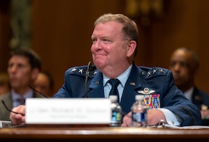 Lt. Gen. Richard W. Scobee, Chief of the Air Force Reserve and commander of the Air Force Reserve Command smiles after being congratulated for his upcoming retirement by U.S. senators from the Senate Approptiations Subcommittee on Defense