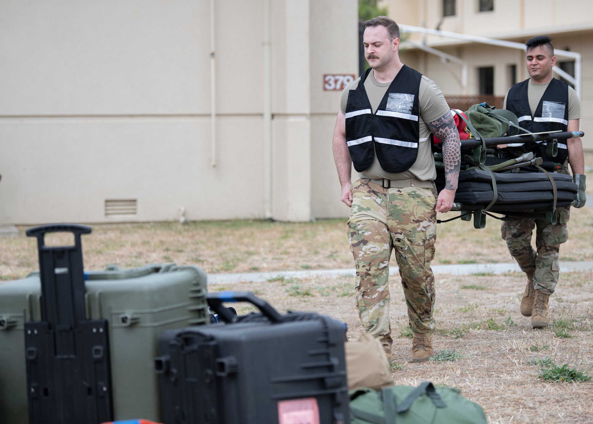 Airmen from the 349th Aeromedical Evacuation Squadron prepare equipment in support of a simulated mission during Exercise Nexus Rising held at Travis Air Force Base, June 4, 2022. Nexus Rising is a readiness exercise designed to test the ability of the 349th Air Mobility Wing to generate, employ and sustain air operations in a simulated combat environment. Missions in Nexus Rising include air rescue, aeromedical evacuation, airlift for cargo and personnel, aerial refueling, deployment processing, aerial port operations, and command and control. Reserve Citizen Airmen from Travis Air Force Base, California, Army National Guard members from Fairfield, and California Air National Guard members from Moffett Field are participating in the exercise, June 3-5, 2022.  (U.S. Air Force photo by Master Sgt. Jose B. Aquilizan)