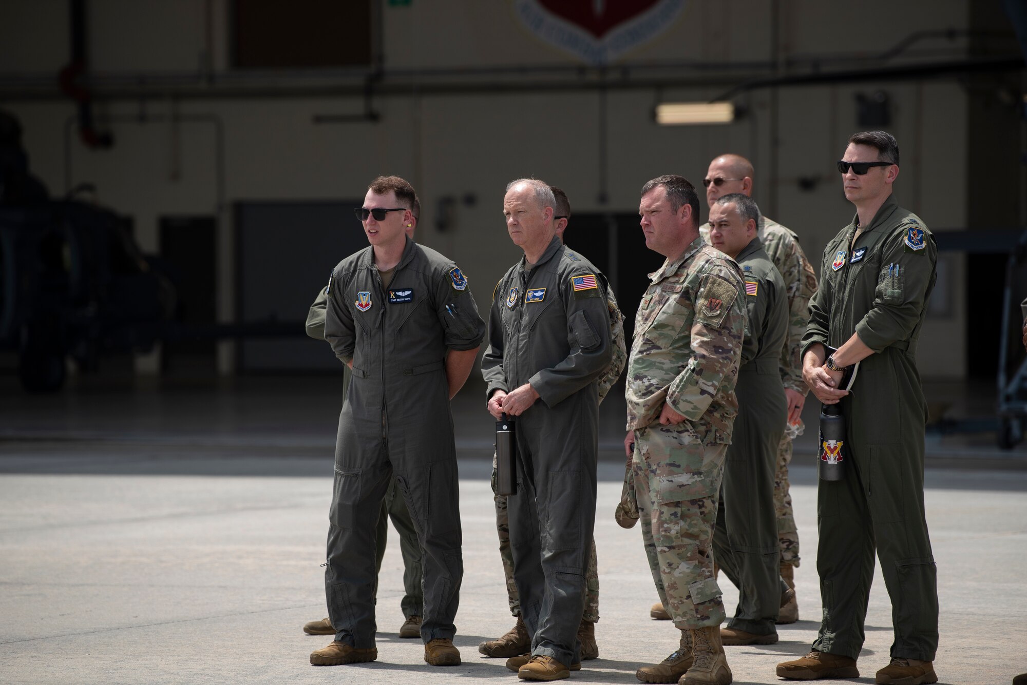 A photo of a bunch of Airmen standing on the flightline.
