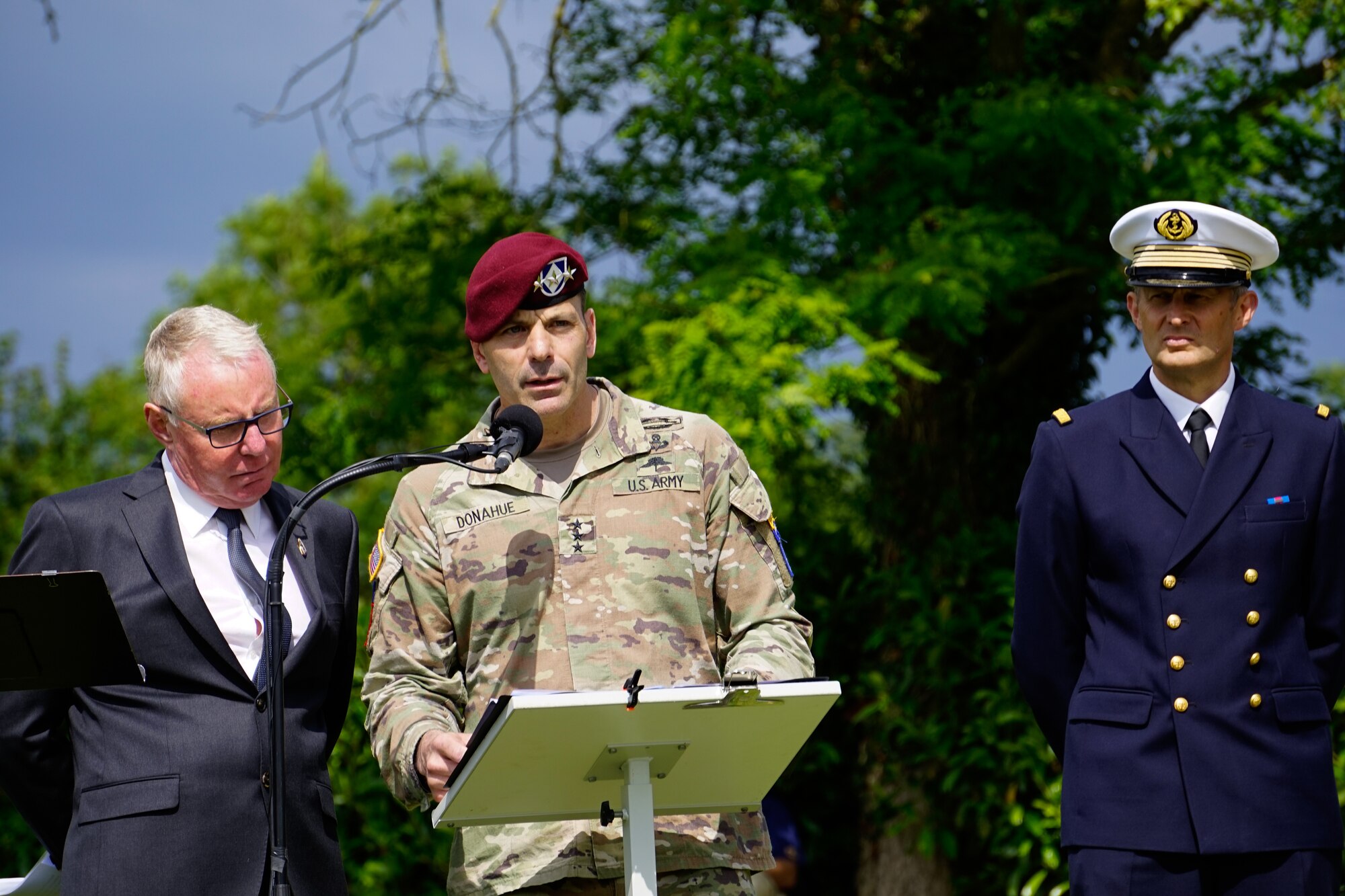 U.S. Army Gen. Christopher Donahue, commanding general of the 82nd Airborne Division at Fort Bragg, N.C., speaks to attendees at the Iron Mike Memorial Ceremony in Normandy, France, June 5, 2022. Iron Mike is an airborne trooper statue, and is a tribute to the American Soldiers who bravely fought on D-Day. (U.S. Air Force photo by Airman 1st Class Lauren Jacoby)