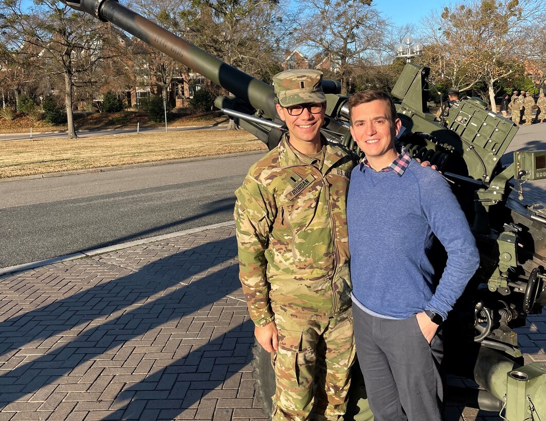 1st Lt. Justin Riordan, at left, poses with his husband in Richmond, Virginia.