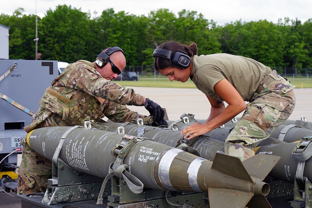 Airmen from the 127th Maintenance Squadron, Selfridge Air National Guard Base, Mich. perform Agile Combat Employment training while securing bombs to a transport cart