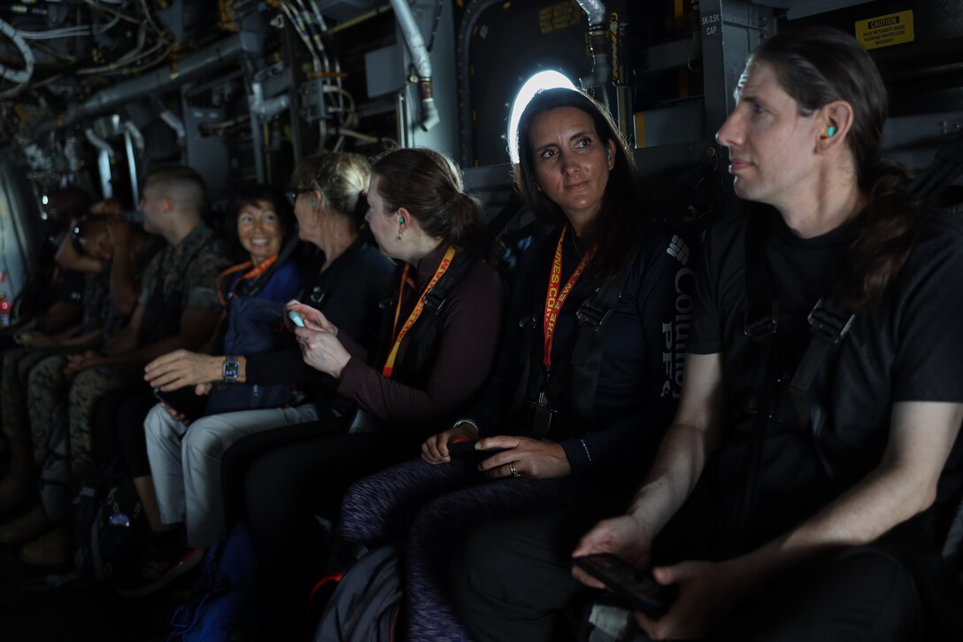 Collegiate educators from across the Nation ride in an MV-22B Osprey during their visit to Marine Helicopter Squadron One (HMX-1) at Marine Corps Base Quantico, Va., June 9, 2022. The Marine Corps Recruiting Command's Educators’ Workshop presents collegiate academic influencer’s  the opportunity to experience the training Marines provide to the next generation. (U.S. Marine Corps photo by Lance Cpl. Hannah Hollerud)