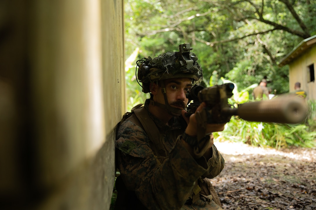 A U.S. Marine with 3rd Marine Division provides security during a squad competition at the Jungle Warfare Training Center on Okinawa, Japan, May 25, 2022. The week-long competition was held to test squads from across the Marine Corps in their mastery of warfighting skills.