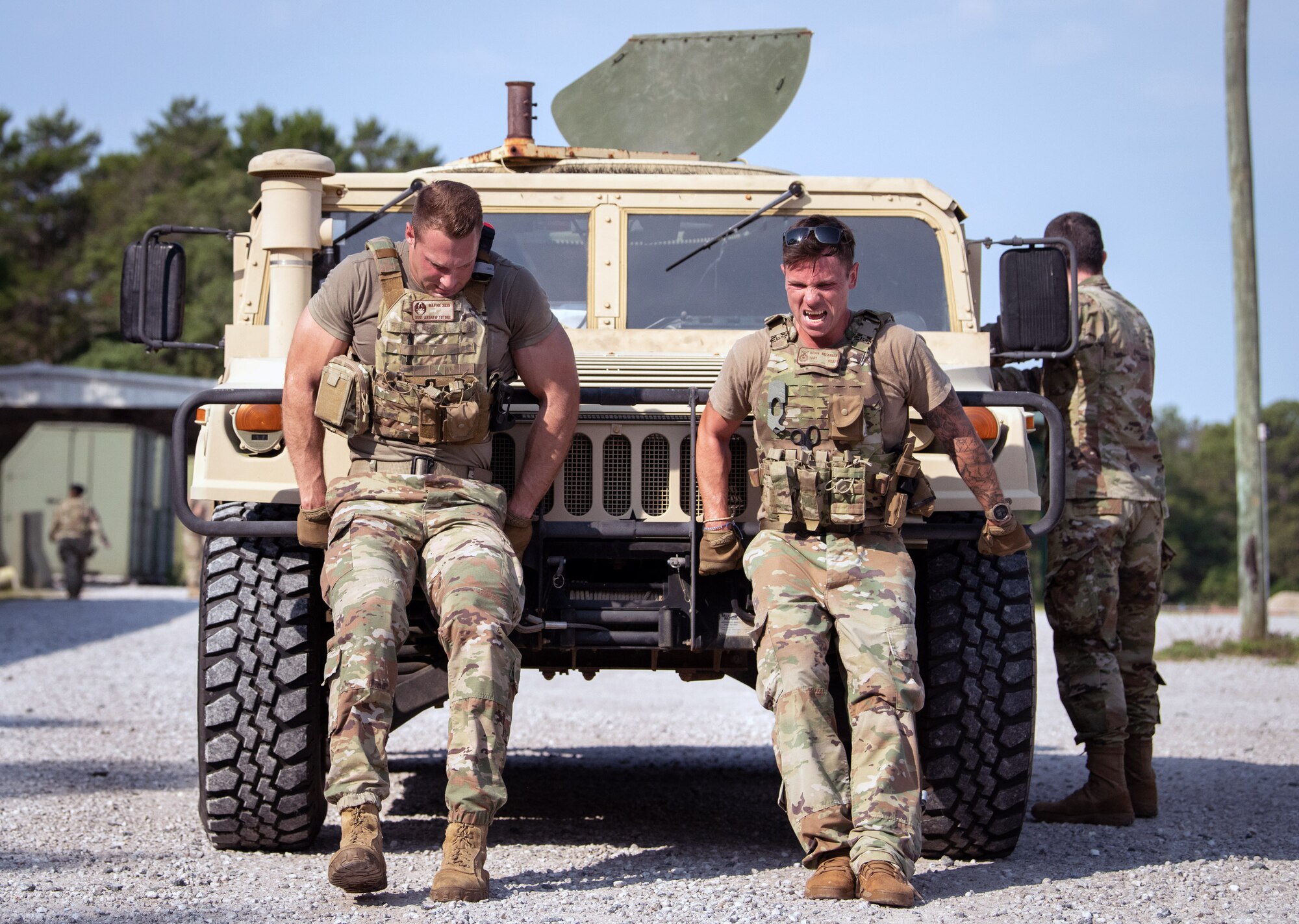 Staff Sgt. Andrew Tutone and Tech. Sgt. Kevin Belanger, both assigned to the 96th Security Forces Squadron, push a Humvee