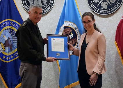 Mari Dugas receives a letter of appreciation from Gen. Paul Nakasone, Commander, U.S. Cyber Command, after completing the Student Volunteer Program (SVP) at USCYBERCOM.

SVP is a new USCYBERCOM pilot talent initiative program for current graduate-level collegiate students. The SVP is designed to provide current students with an experiential project at USCYBERCOM as a voluntary unpaid intern for one semester (with an option to extend up to one academic year). Student volunteers offer specialized expertise or skillsets bringing project-specific talent to the USCYBERCOM formation while receiving vital professional experience and collegiate credit.

The SVP was piloted in the Staff Judge Advocate (SJA) office from September 2021 to May 2022. Dugas was the command's first-ever student volunteer. She completed the program during her third year at New York University School of Law.