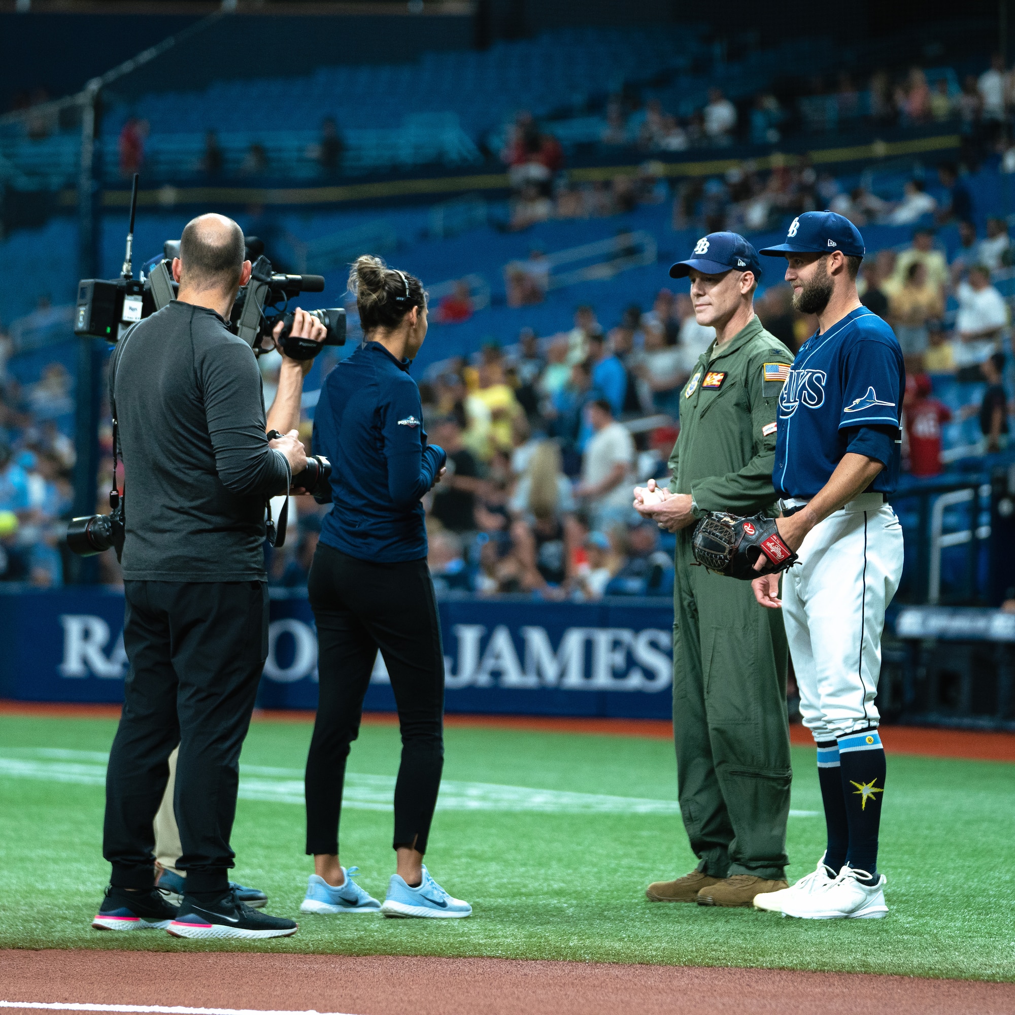 U.S. Air Force Col. Benjamin Jonsson speaks with the Tampa Bay Rays public affairs team prior to a game at Tropicana Field in St. Petersburg, Florida, June 8, 2022.