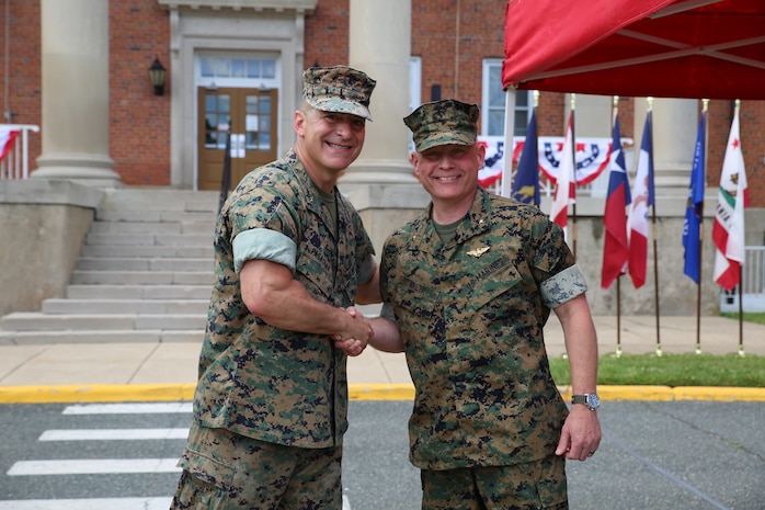 Outgoing Marine Corps Systems Command commander, Brig. Gen. Arthur J. Pasagian (left), shakes hands with incoming commander Brig. Gen. David C. Walsh following a Change of Command June 9 at Marine Corps Base Quantico, Virginia (U.S. Marine Corps photo by Andrew Reynolds).