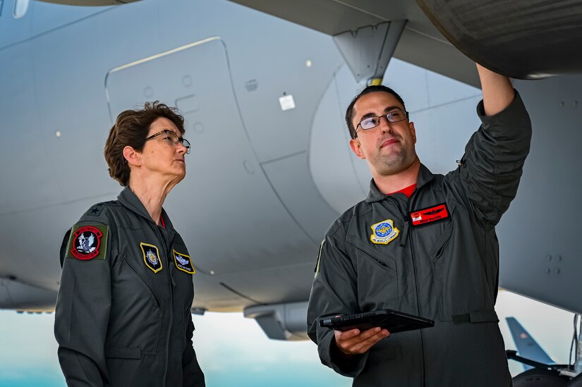 U.S. Air Force Gen. Jacqueline Van Ovost, U.S. Transportation Command commander, and U.S. Air Force Major Brian Walford, 305th Air Mobility Wing pilot, inspect a KC-46A Pegasus at Joint Base McGuire-Dix-Lakehurst, New Jersey, June 3, 2022. Van Ovost toured the Air Force’s newest refueling tanker, the KC-46A Pegasus and met with warfighters who project its military power globally.