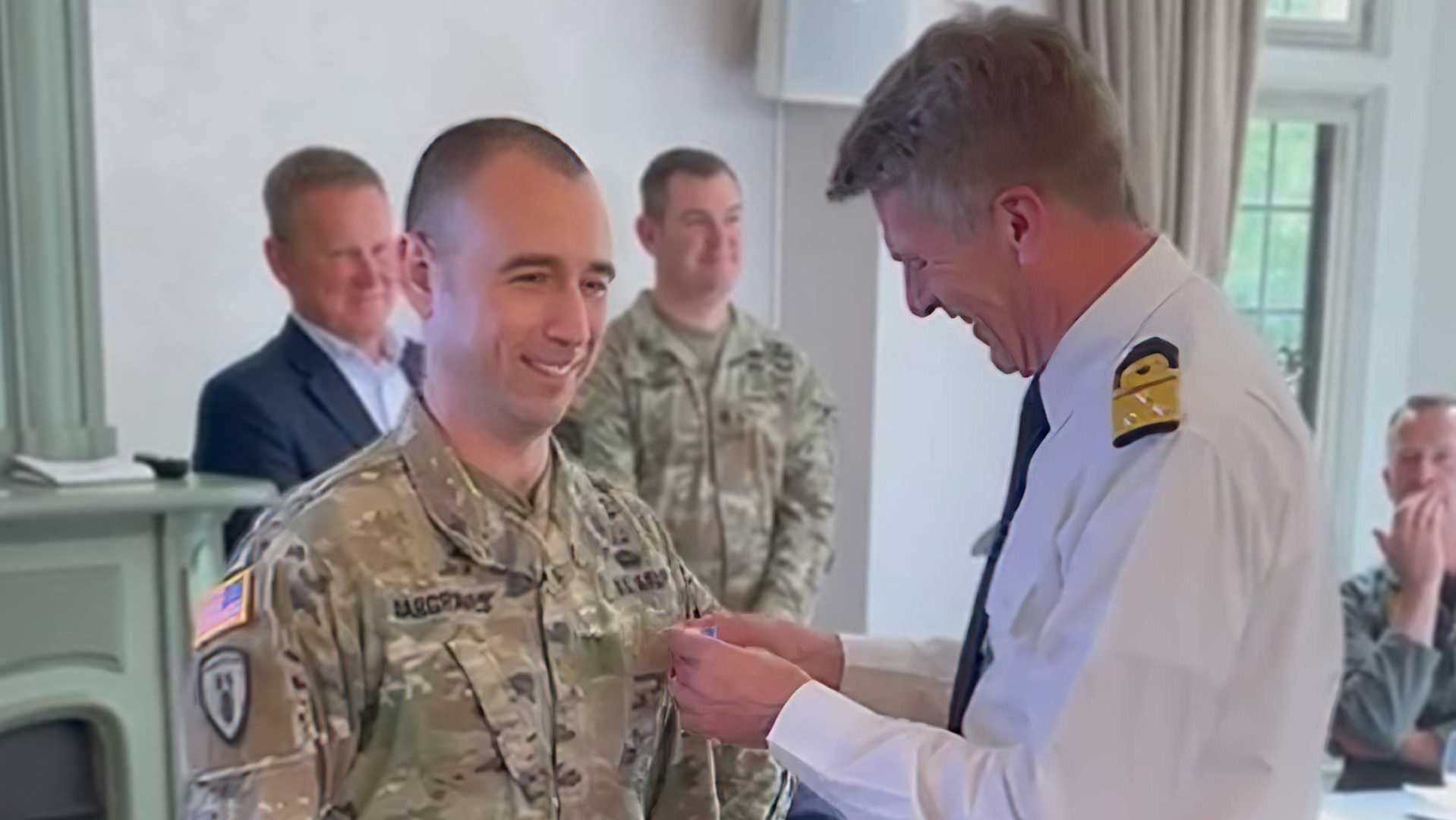 U.S. Army Major Drew Hargraves, receives the Medal of Merit from Netherlands Vice Admiral Boudewijin.