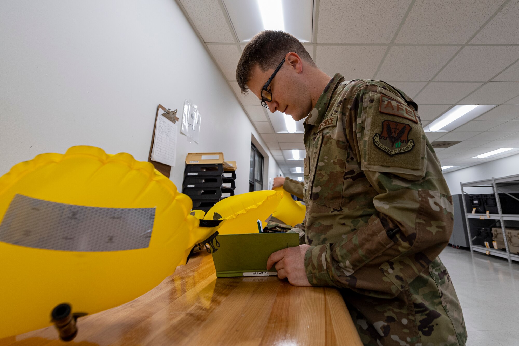 Photo of an Airman taking notes