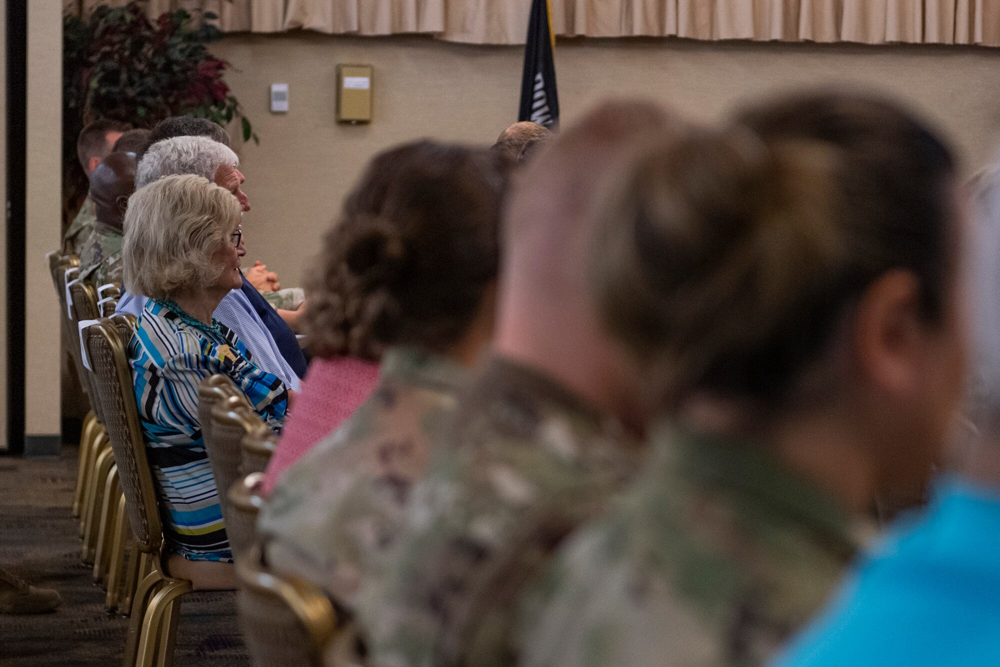 Photo of an Airman listening to remarks