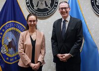 Mari Dugas, U.S. Cyber Command’s first-ever student volunteer in the Student Volunteer Program (SVP) at USCYBERCOM, stands with Dr. Michael Sulmeyer, Principal Cyber Advisor, Secretary of the Army, after a Letter of Appreciation ceremony for her at the command.

SVP is a new USCYBERCOM pilot talent initiative program for current graduate-level collegiate students. The SVP is designed to provide current students with an experiential project at USCYBERCOM as a voluntary unpaid intern for one semester (with an option to extend up to one academic year). Student volunteers offer specialized expertise or skillsets bringing project-specific talent to the USCYBERCOM formation while receiving vital professional experience and collegiate credit.
 
The SVP was piloted in the Staff Judge Advocate (SJA) office from September 2021 to May 2022. Dugas completed the program during her third year at New York University School of Law. Sulmeyer previously served as Gen. Nakasone's Special Advisor and helped launch the SVP pilot alongside the command.
