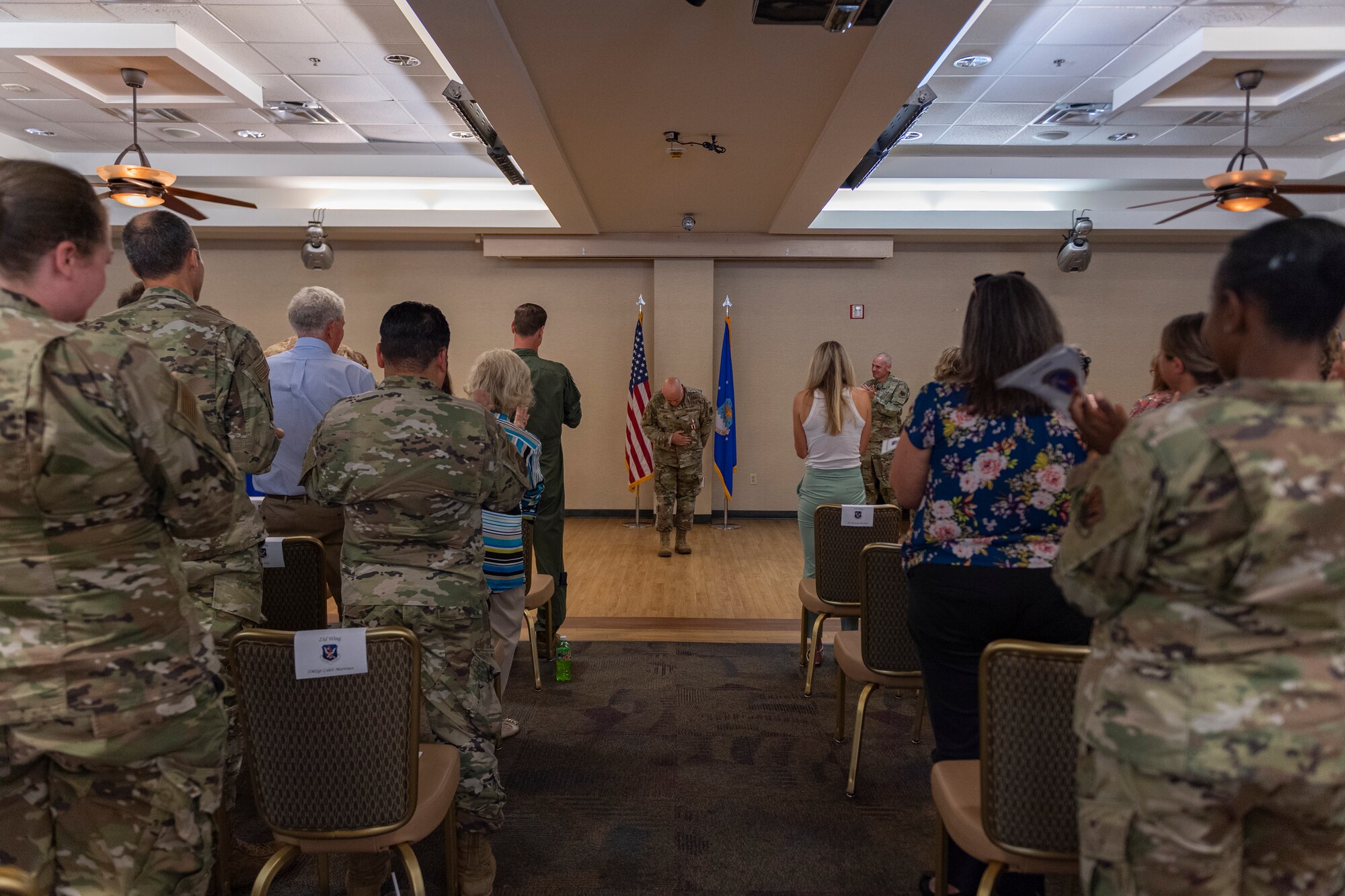 Photo of Team Moody members applauding an Airman