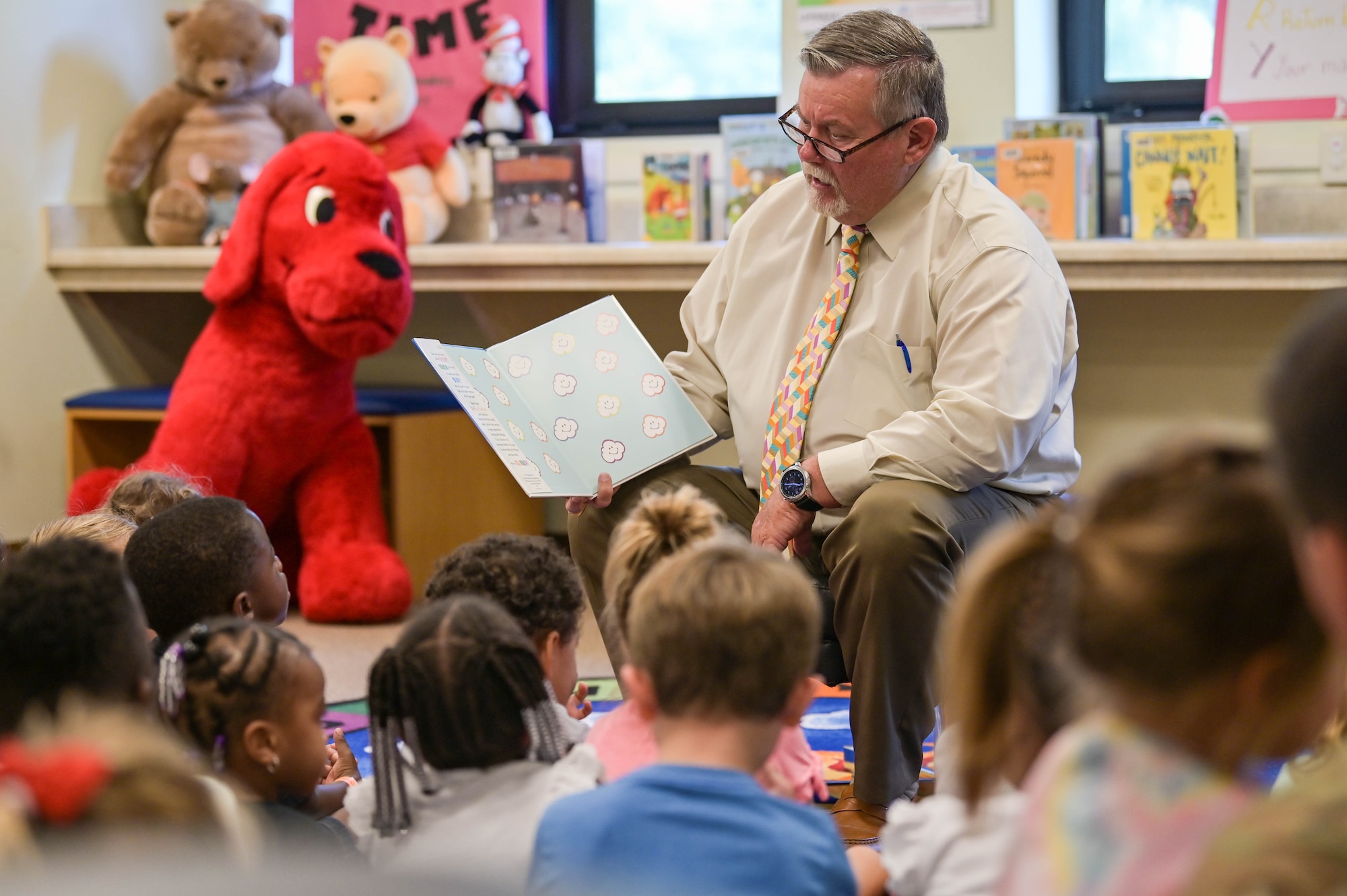Chairman Bill Slaughter, Lowndes County Commission, reads a book to children from the Child Development Center at Moody Air Force Base, Georgia, June 7, 2022. Chairman Slaughter read the book “I am a Rainbow” by Dolly Parton, which spoke about colors and the feeling they’re associated with. (U.S. Air Force photo by Senior Airman Rebeckah Medeiros)