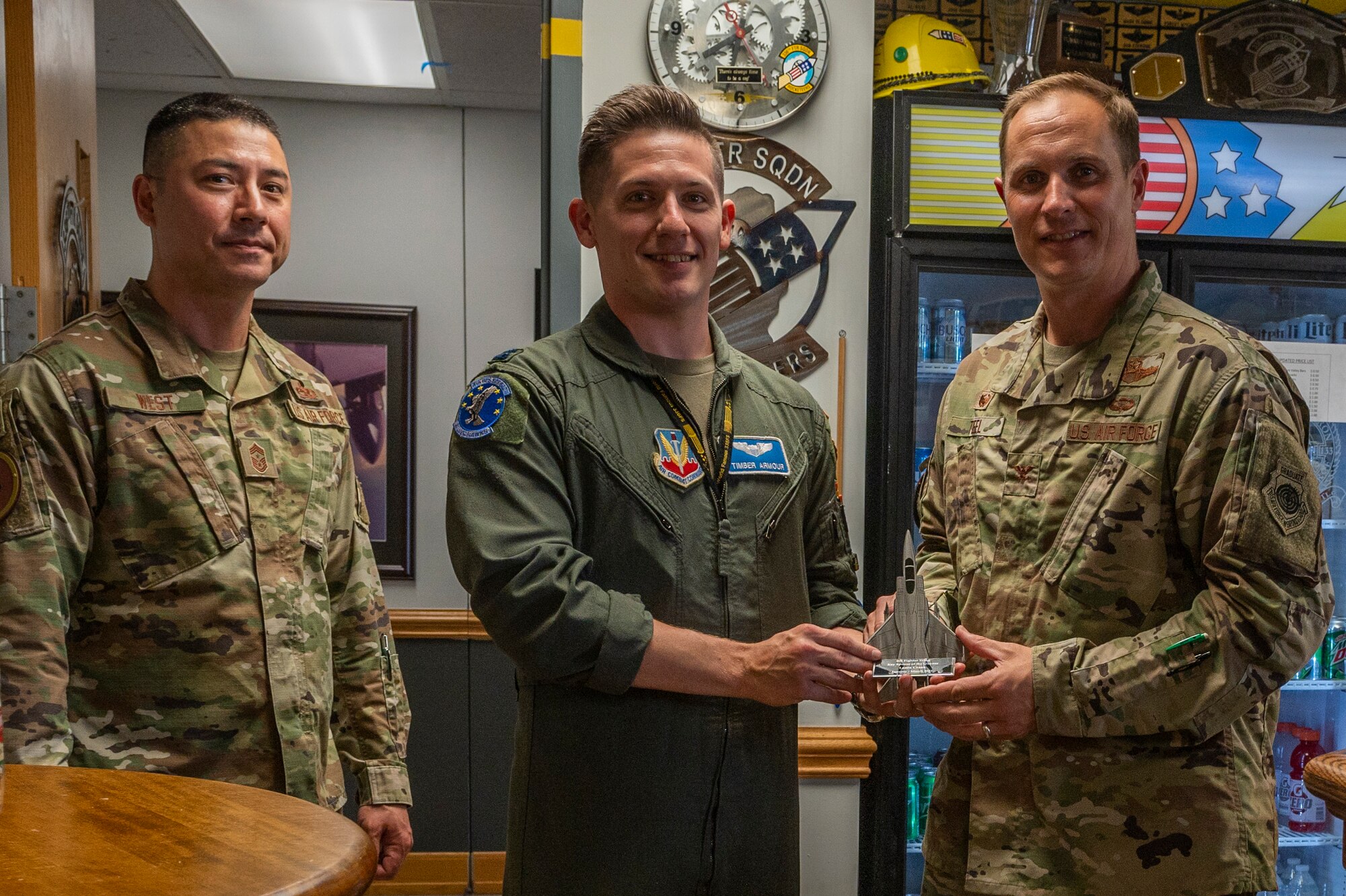 Armour accepted the award on behalf of his wife, Laura Crank, 336th FS key spouse, who was named the key spouse of the 1st quarter for 2022. (U.S. Air Force photo by Senior Airman Kylie Barrow)