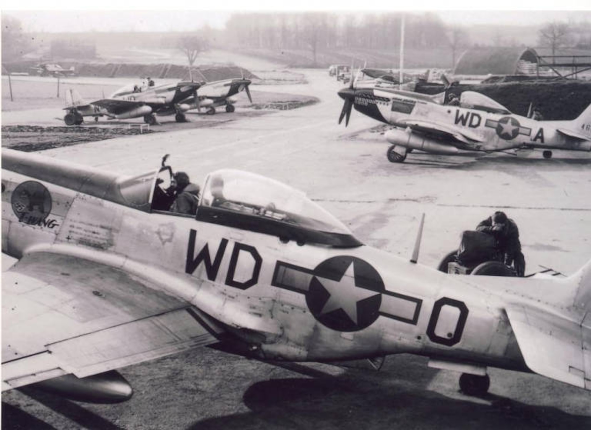 A photograph of a P-51 Mustang of the 335th Fighter Squadron parked in a revetment at Debden Air Base in England. (Courtesy Photo)