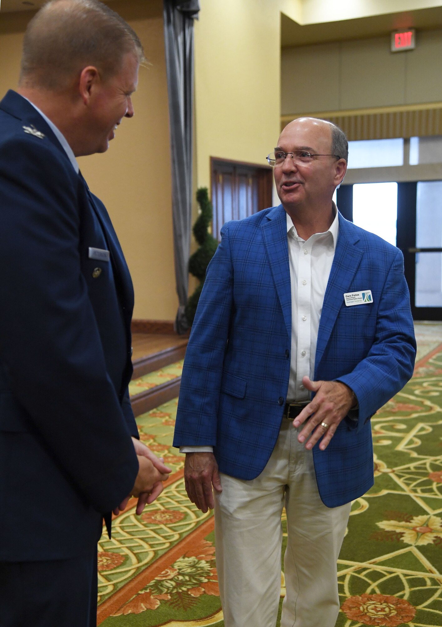 U.S. Air Force Col. Kirk Peterson, Second Air Force acting vice commander, speaks with Gary Fulton, Keesler Federal credit Union Branch Operations Eastern Region director, during the Biloxi Chamber of Commerce State of Keesler Air Force Base Annual Morning Call inside the Bay Breeze Event Center at Keesler Air Force Base, Mississippi, June 10, 2022. The event is designed to exchange information with business and community leaders and to strengthen Keesler's bond with the local community and allows for vast networking opportunities with business leaders and stakeholders. Furthermore, this is an opportunity for Keesler to highlight its mission to those who are not familiar with its capabilities. (U.S. Air Force photo by Kemberly Groue)