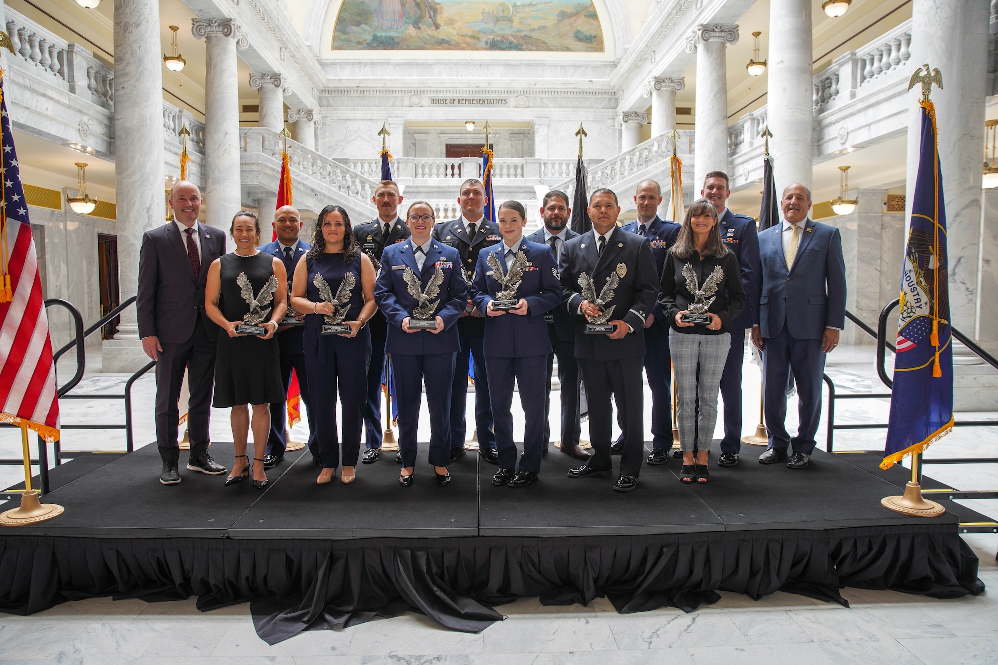 Recipients of the Utah Service Member of the Year pose with Utah Gov. Spencer Cox and Utah Department of Military & Veteran Affairs Gary Harter