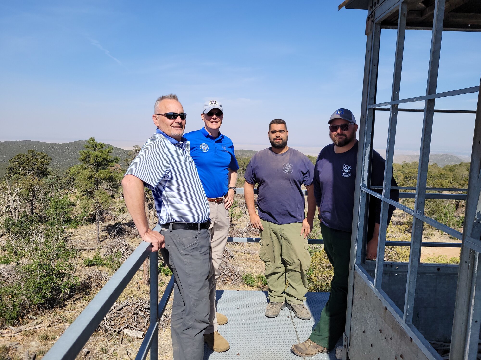 Men posing for photo.