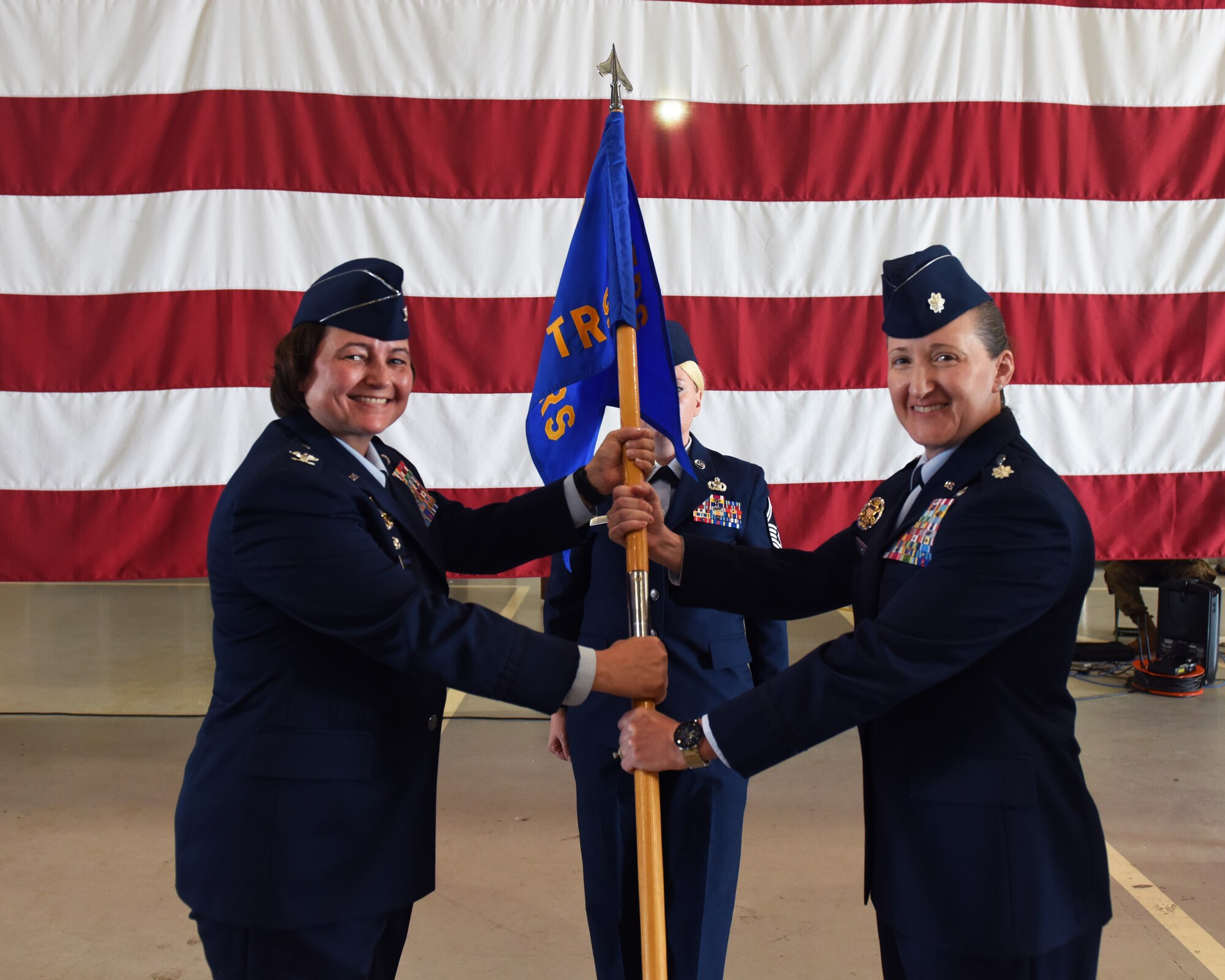 U.S. Air Force Lt. Col. Liane Zivitski, right, 315th Training Squadron incoming commander, assumes command from Col. Angelina Maguinness, 17th Training Group commander, during the 315th TRS change of command ceremony at Goodfellow Air Force Base, Texas, June 10, 2022. Change of commands are a military tradition representing the transfer of responsibilities from the presiding official to the incoming official. (U.S. Air Force photo by Airman 1st Class Zachary Heimbuch)