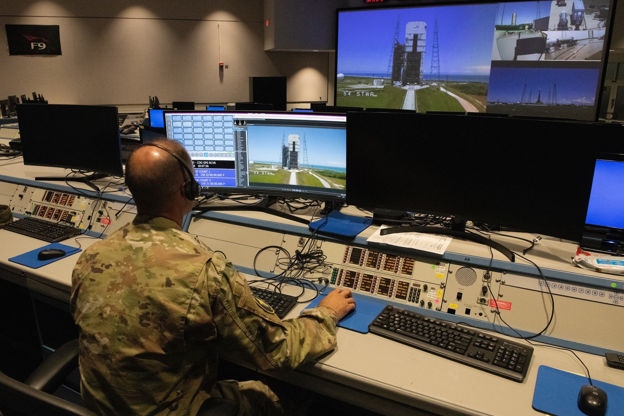 U.S. Space Force Capt. Mark Conque, 1st Range Operations Squadron assistant director of operations, uses the Range Applications Deployment system to assess operations June 7, 2022, at Cape Canaveral Space Force Station, Fla. The RAD system offers up to 25 video feeds to support space launch missions. (U.S. Space Force photo by Tech. Sgt. James Hodgman)