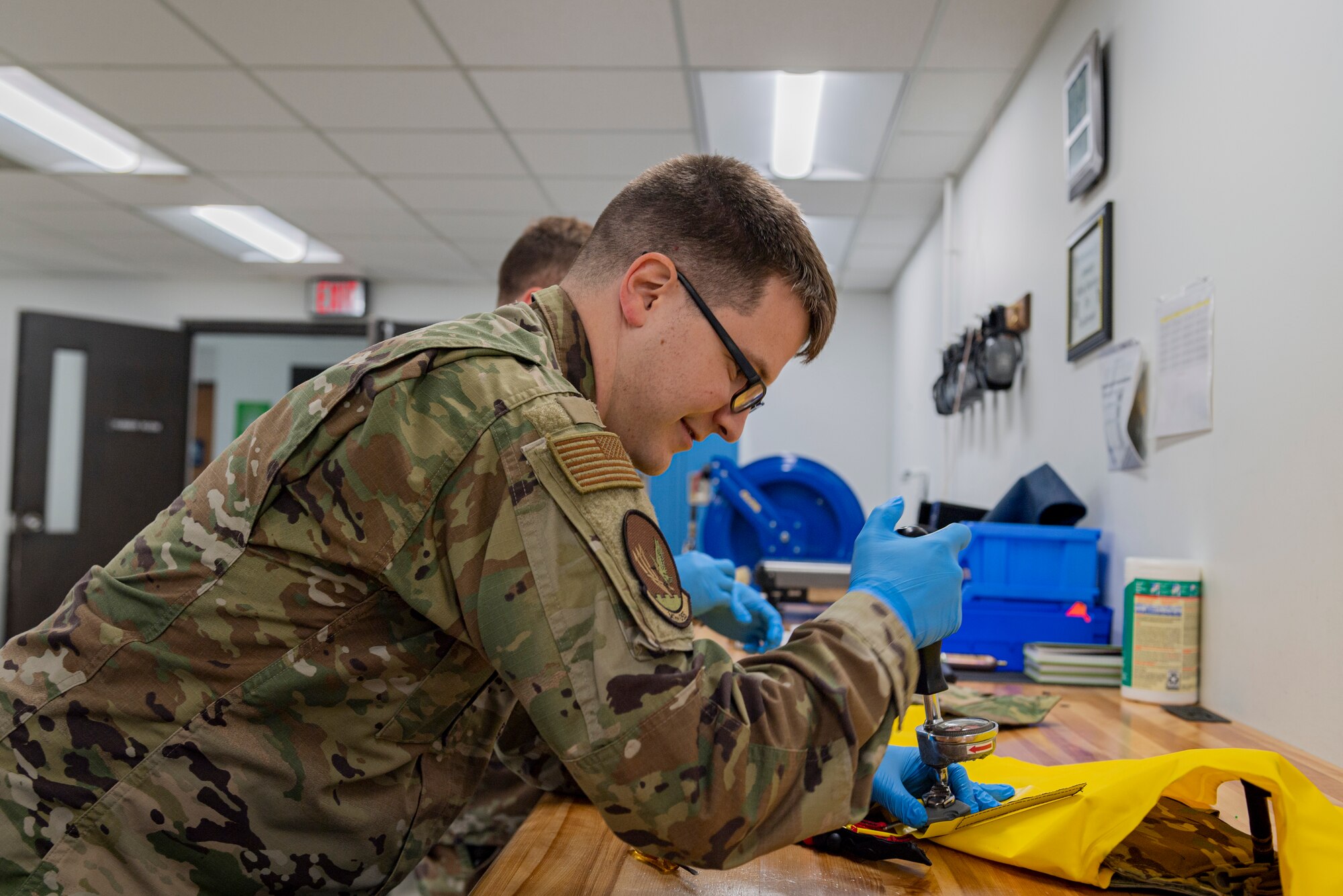 Photo of an Airman torquing an actuator nut
