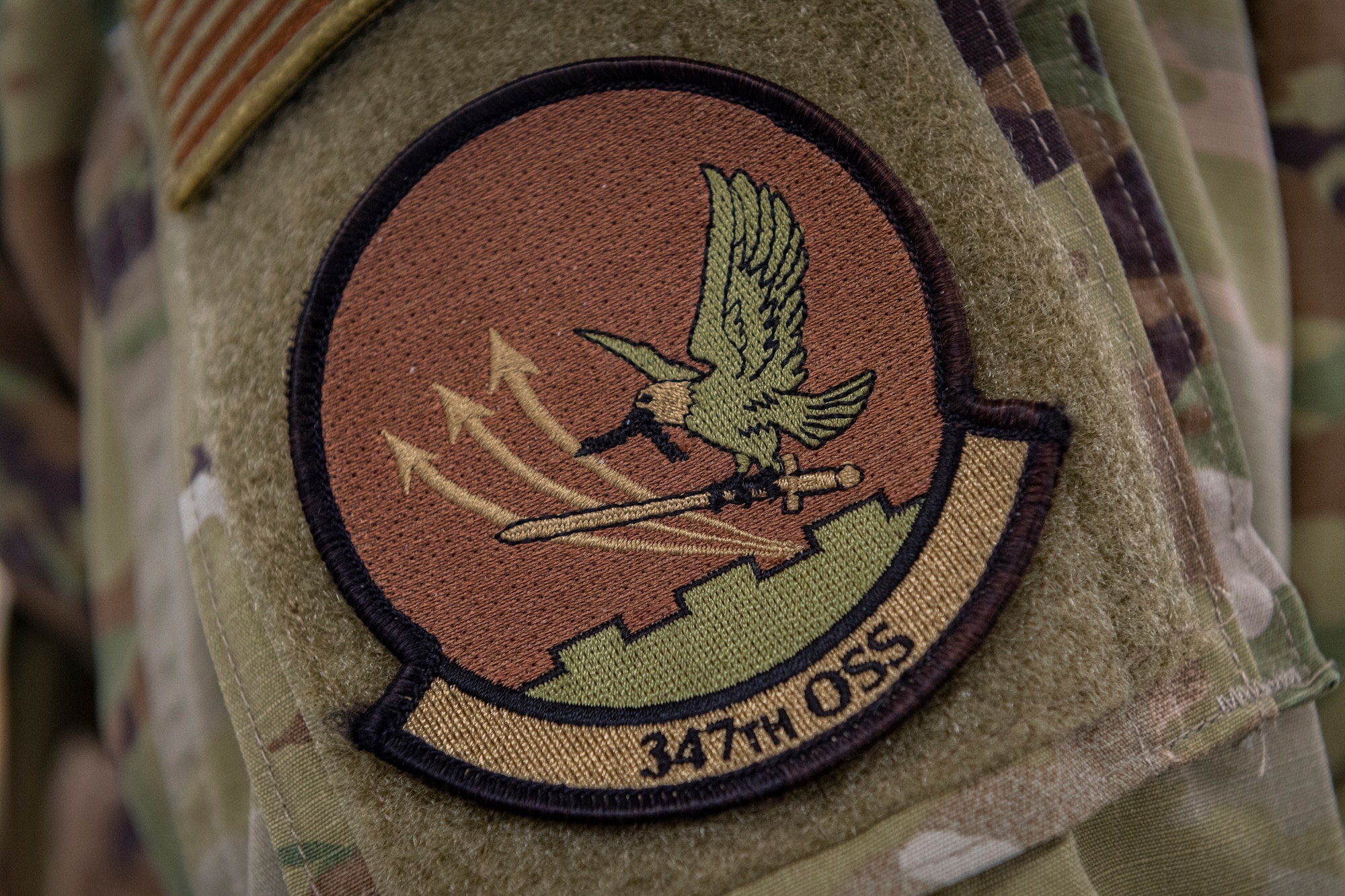 Photo of a patch sitting on an Airman's shoulder