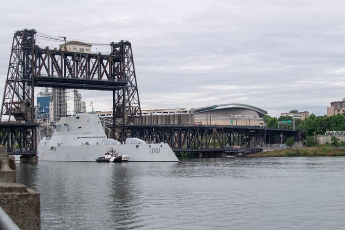 The Zumwalt-class destroyer USS Michael Monsoor (DDG 1001) passes beneath Steel Bridge in Portland, Oregon for Portland Fleet Week 2022.