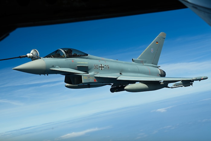 A German Air Force Eurofighter Typhoon attaches to the Multi-Point Refueling System of a KC-135 Stratotanker aircraft, assigned to Royal Air Force Mildenhall, England, over the Baltic Sea Region during BALTOPS-22, June 9, 2022.