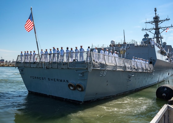 Sailors assigned to the Arleigh Burke-class guided-missile destroyer USS Forrest Sherman (DDG 98) man the rails as they departed on deployment from their home port of Norfolk, June 11.