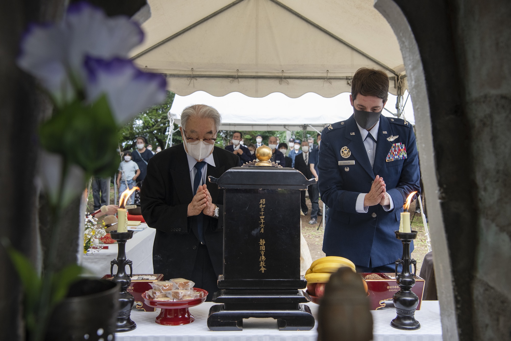Dr. Hiroya Sugano, ceremony host, left, and U.S. Air Force Col. Julie Gaulin, 374th Airlift Wing vice commander, participate in an incense offering ceremony during a U.S.-Japan Joint Memorial Service June 11, 2022, at Mt. Shizuhata, Shizuoka city, Japan. The memorial service provided participants the opportunity to honor those who lost their lives during a World War II air raid on June 20, 1945. During the raid, two U.S. Army Air Forces B-29 Superfortresses collided mid-air over Shizuoka City, resulting in the death of 23 Airmen on board the aircraft. Representatives of the U.S. Air Force’s Yokota Air Base, Japan Self Defense Force, and Shizuoka City rendered their respects to the Airmen and Japanese civilians who lost their lives as a result of the tragedy, and reflected on the strong alliance the U.S. and Japan have forged since the end of World War II. (U.S. Air Force photo by Tech. Sgt. Christopher Hubenthal)
