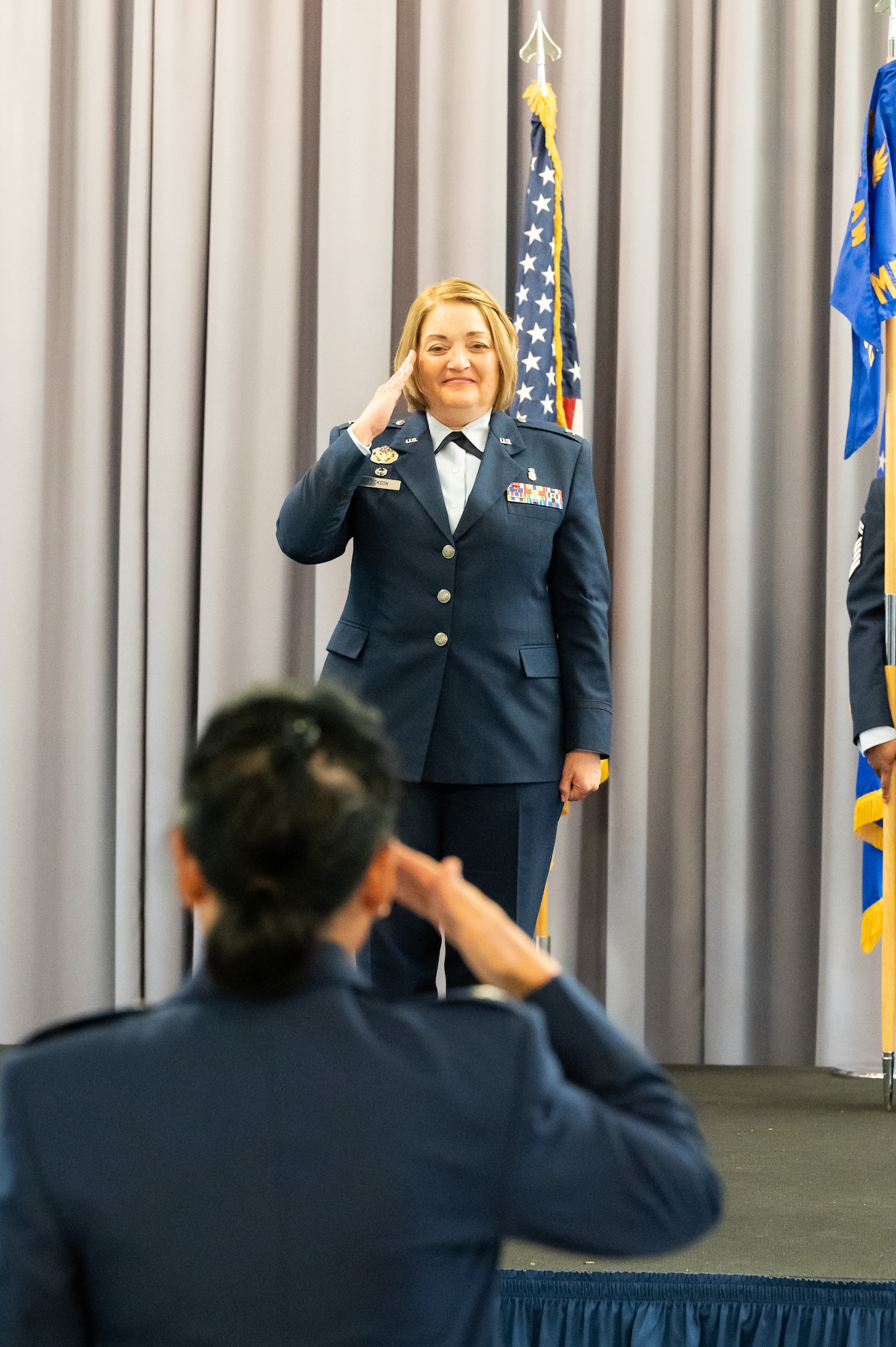 Col. Peggy Dickson, 436th Medical Group commander, receives her first salute from her unit during the 436th MDG change of command ceremony at Dover Air Force Base, Delaware, June 9, 2022. Dickson was previously the commander of the 10th Dental Squadron at the U.S. Air Force Academy in Colorado. (U.S. Air Force photo by Mauricio Campino)