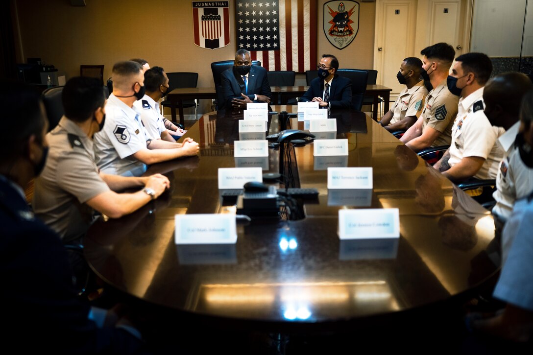 Defense Secretary Lloyd J. Austin III meets with service members.