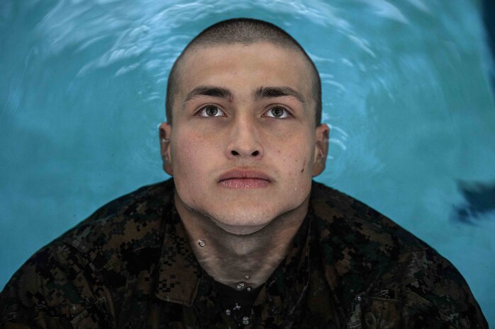 U.S. Marine Corps Recruit Damian Depriest with Delta Company, First Recruit Training Battalion, floats during the first day of swim training at Marine Corps Recruit Depot San Diego, June 6, 2022.