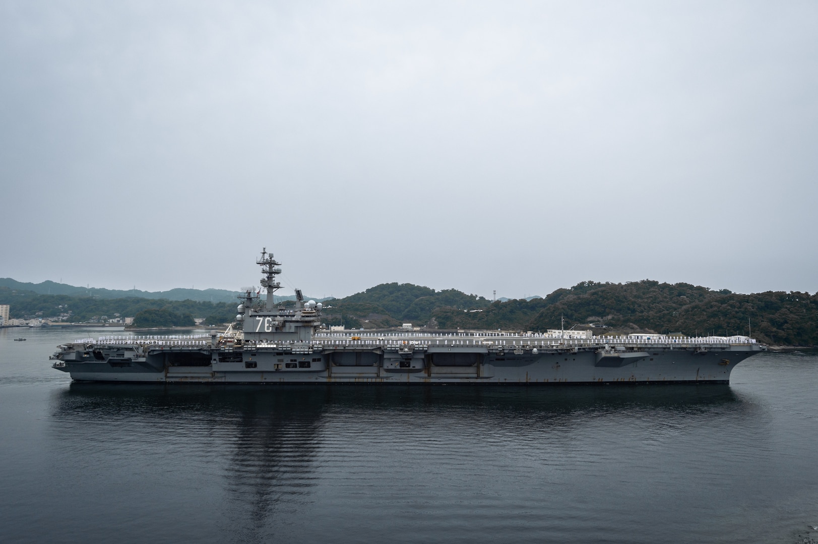 The U.S. Navy's only forward-deployed aircraft carrier, USS Ronald Reagan (CVN 76) departs Commander, Fleet Activities Yokosuka (CFAY) for a regularly scheduled deployment, May 20, 2022. Ronald Reagan is deployed to the U.S. 7th Fleet area of operations in support of a free and open Indo-Pacific region. For more than 75 years, CFAY has provided, maintained and operated base facilities and services in support of the U.S. 7th Fleet's forward-deployed naval forces, tenant commands, and thousands of military and civilian personnel and their families. (U.S. Navy photo by Seaman Darren Cordoviz)