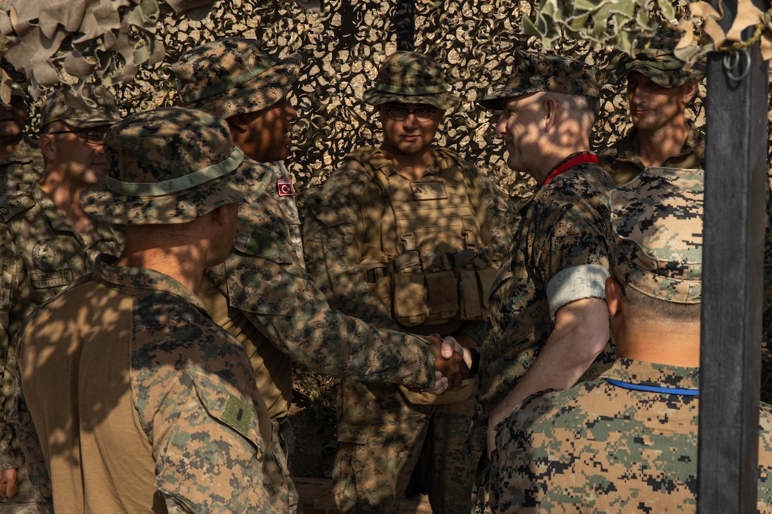 U.S. Marine Corps Maj. Gen. Francis Donovan, commanding general of 2d Marine Division, addresses Marines assigned to Ground Combat Element, 22nd Marine Expeditionary Unit, during Exercise EFES 2022 (EFES 22), near Izmir, Turkey, June 9, 2022. EFES22 is an international combined joint live-fire exercise focused on increasing force readiness, promoting stability and prosperity in the region, and interoperability between the U.S., Turkey, and allied nations. (U.S. Marine Corps photo by Cpl. Kyle Jia)