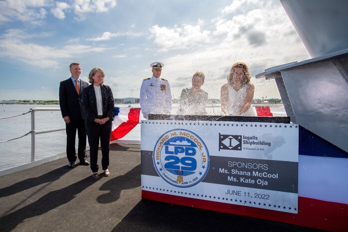 Ship's Sponsors Shana McCool and Kate Oja christened Richard M. McCool Jr. (LPD 29), the U.S. Navy's 13th San Antonio-class amphibious transport dock at HII's Ingalls Shipbuilding division. LPD 29 is named for McCool and Oja's grandfather, Capt. Richard M. McCool Jr., a Medal of Honor recipient. (Courtesy photo)